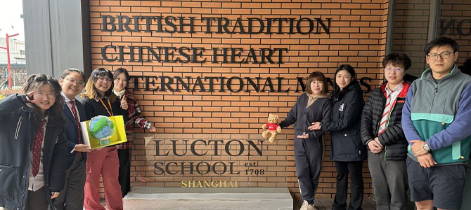 Huyen at Lucton School in China with students and teachers