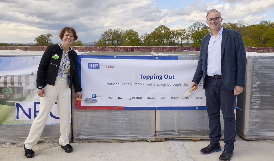Professor Mark Lewis is pictured with Professor Pip Logan at the topping out ceremony held at the National Rehabilitation Centre site.