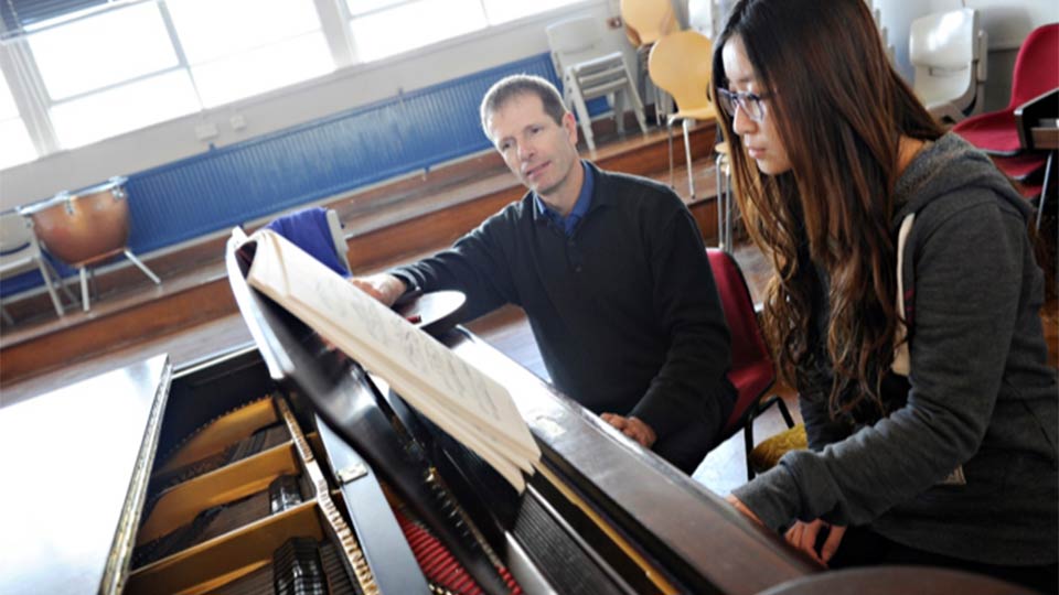 Tutor and pianist during piano lesson