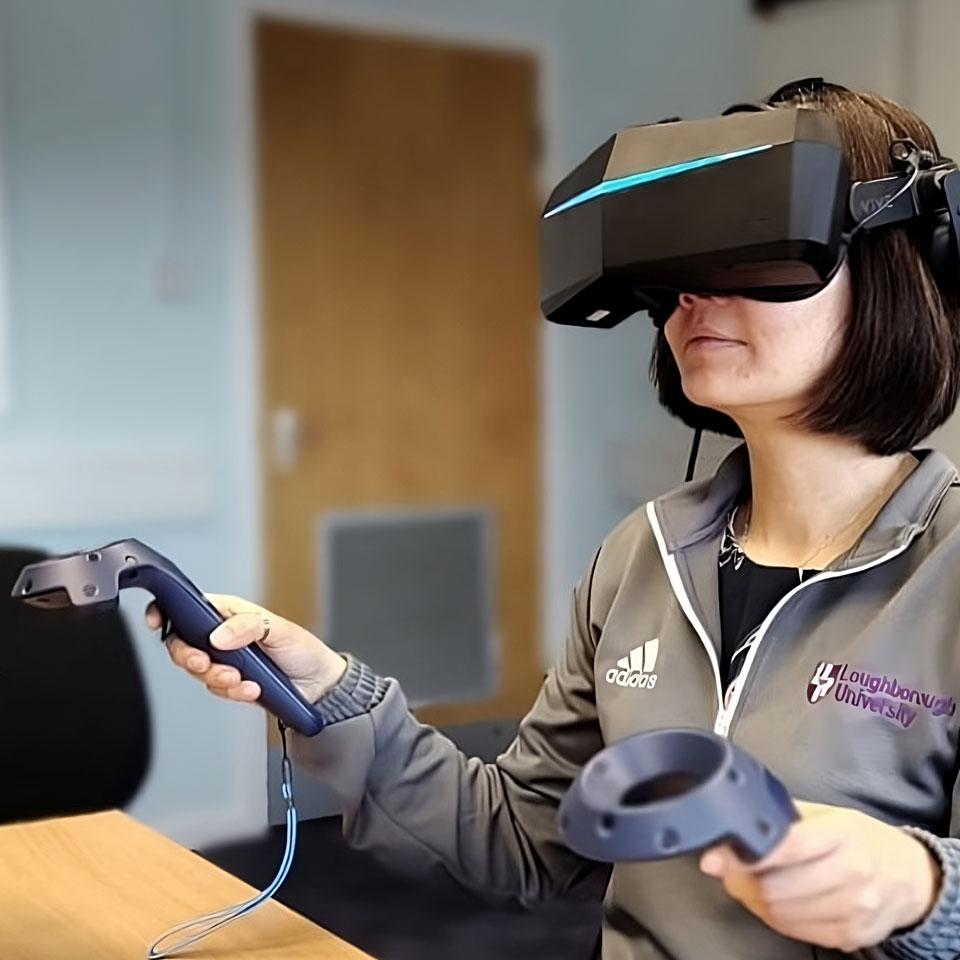 Mey Goh using a VR headset