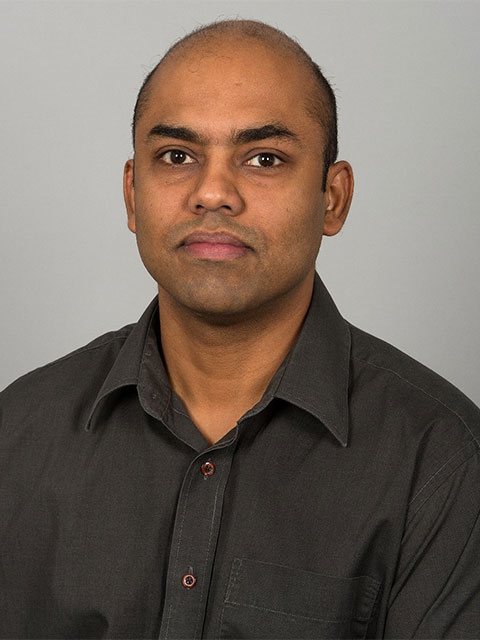 A portrait headshot of Anish, looking directly into the camera.