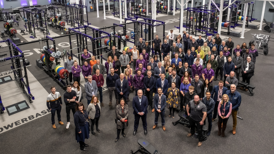 many members of staff and support team standing in the newly updated powerbase gym