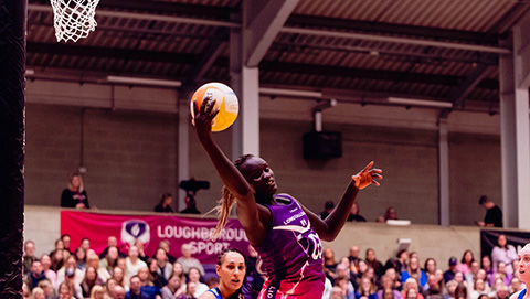 Mary Cholhok contesting a high ball under the shooting post