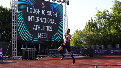a man running around the track