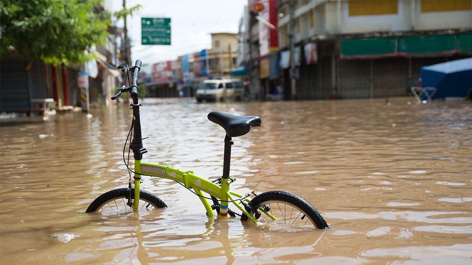A bike in a flooded street