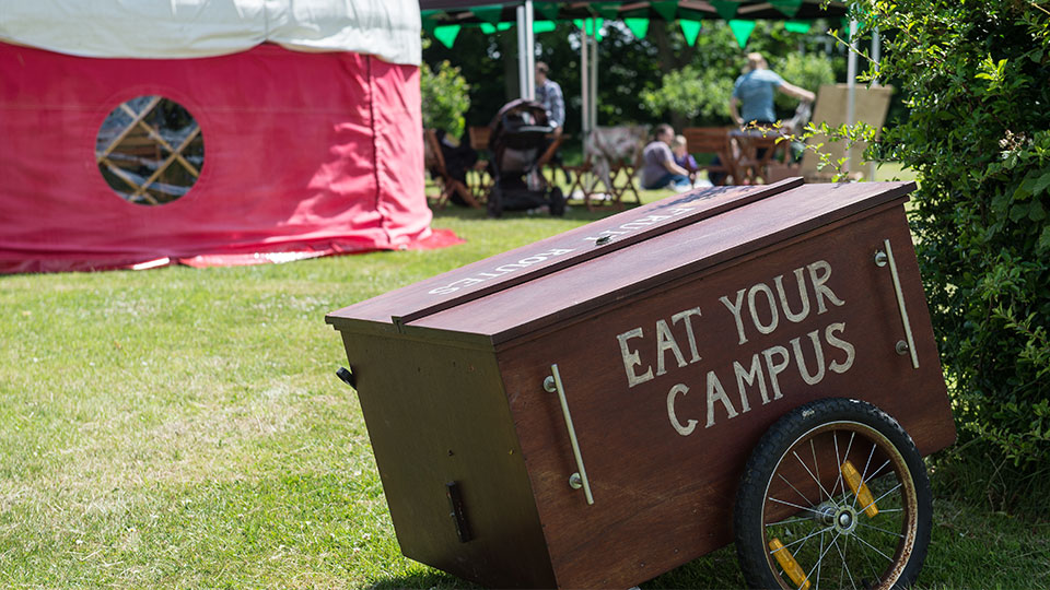 a wagon with the words 'eat your campus' painted on the side 