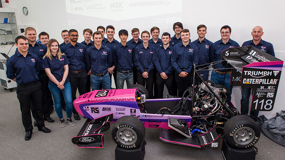 photo of the Formula Student team with the 2018 racing car