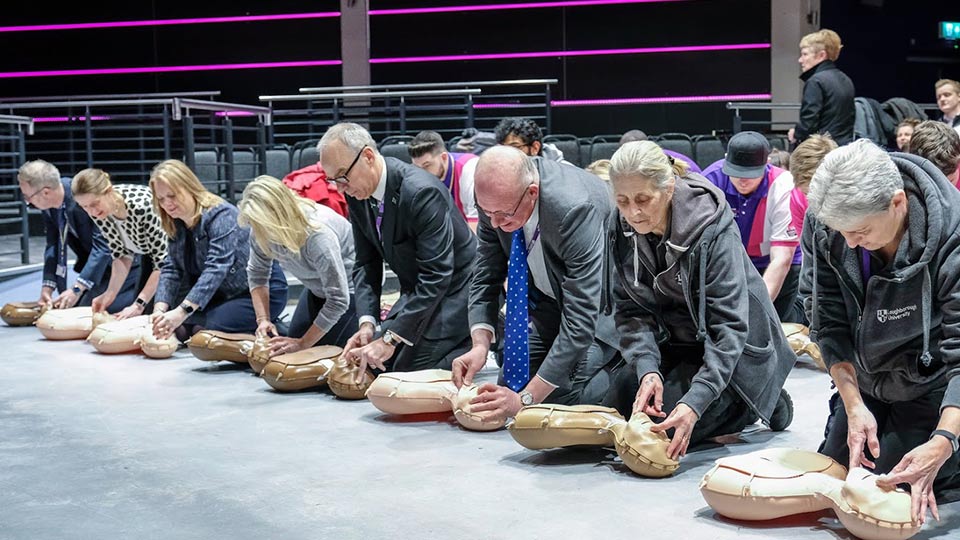 Pictured are staff learning CPR at the Heart 2 Heart event. 