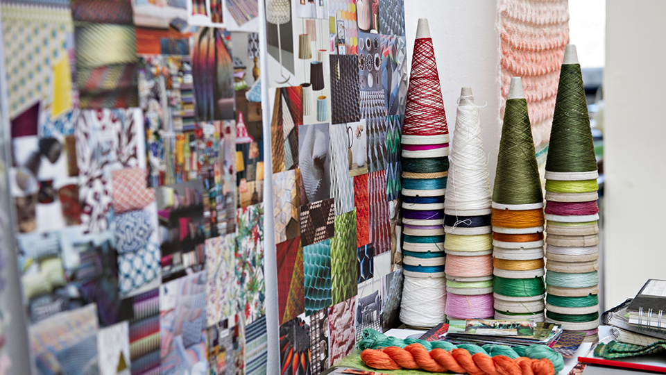 photo of student textile work and woven fabric