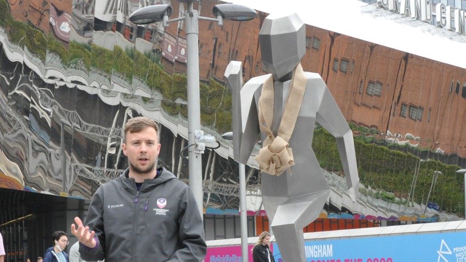 Ben Pearson alongside the sculpture 