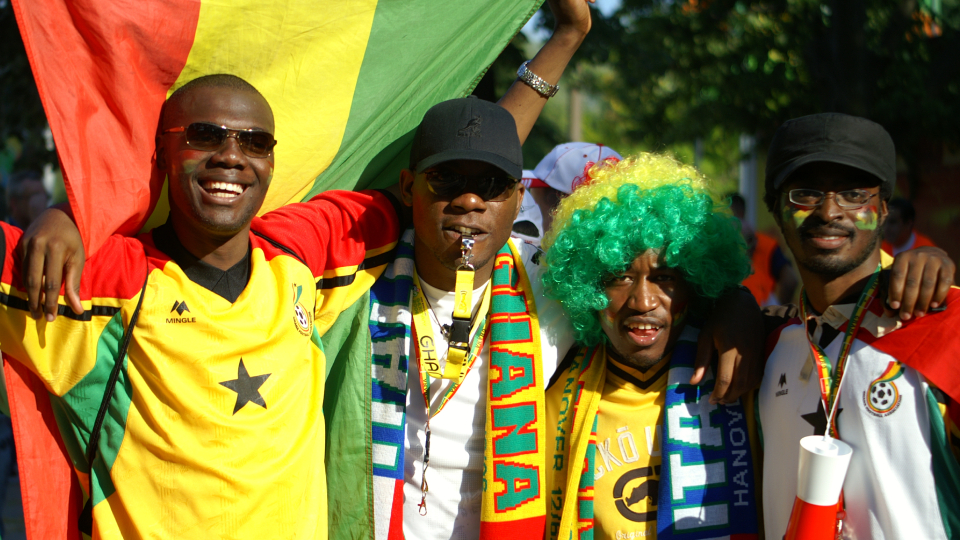 Ghana football fans look at the camera
