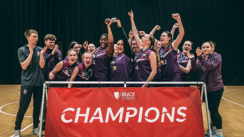 Loughborough basketball women celebrate their bucs victory by lifting a trophy