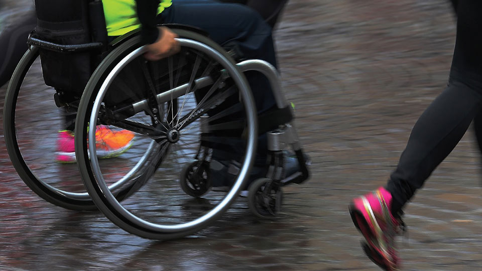 Pictured is a person in a wheelchair and a person running. There is also the National Centre for Sport and Exercise Medicine logo. 