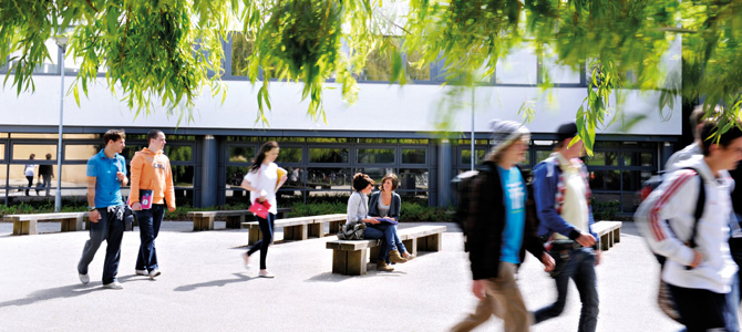 groups of students walking on the campus