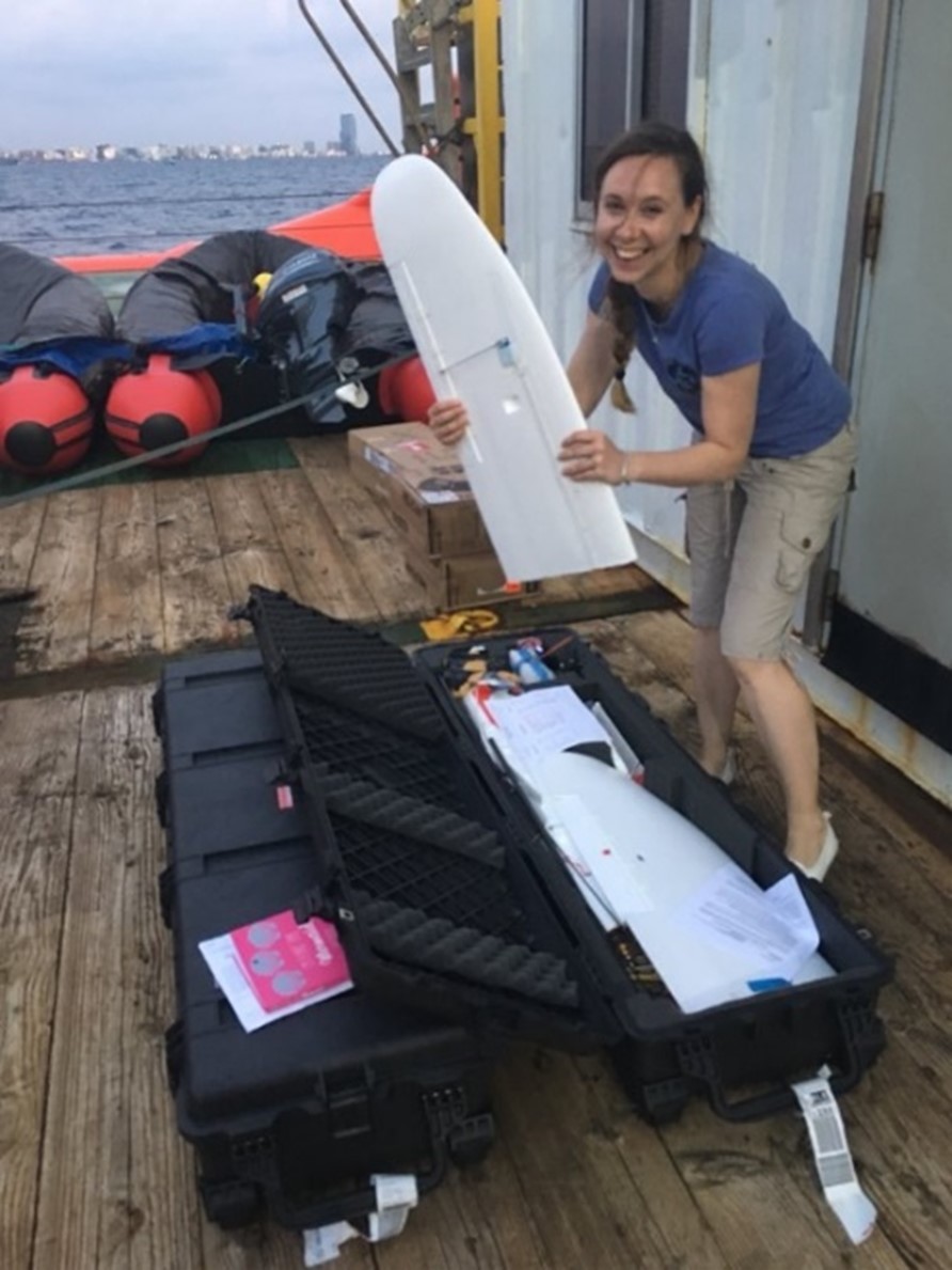 Melissa Schiele with a water-landing fixed-wing drone.