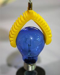 3D printed soft gripper lifting a lightbulb
