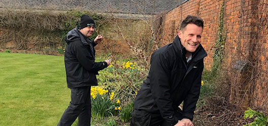 Members of staff gardening on campus