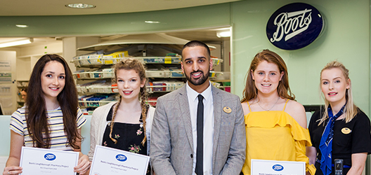 Photo of winning SBE students with Charanjit Singh, Store Manager of the Boots Loughborough store. 