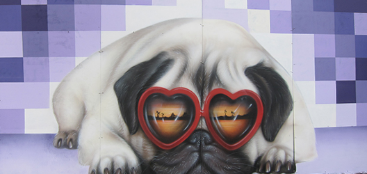 Buber Nebz work of graffiti street art, with a purple background and a pug dog wearing sunglasses