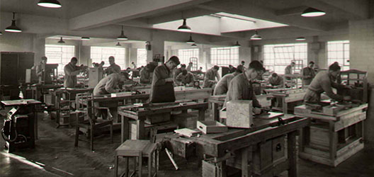 Historical image of furniture being produced at the Handicraft Unit