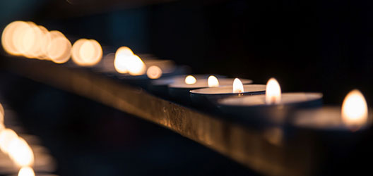 photo of candles burning in a service