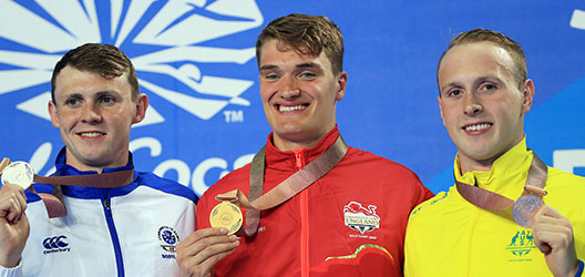 Swimmer James Wilby winning gold for 200m breaststroke at the Commonwealth Games