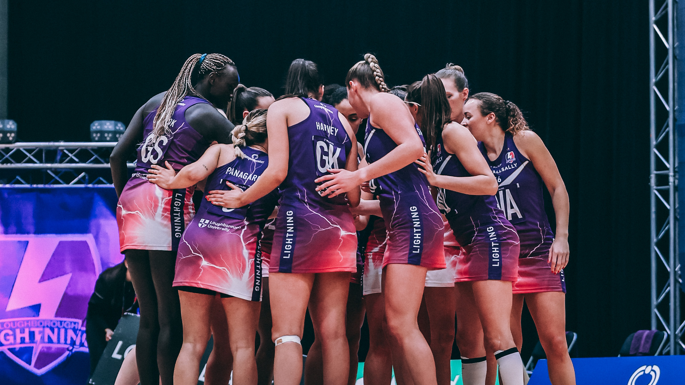 Image of Loughborough Lightning Netball team in a huddle