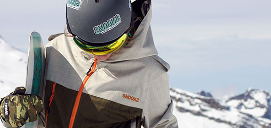 Model wearing Snooks outerwear on ski slope