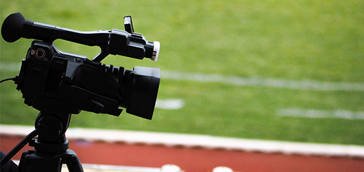 Photo of a video camera looking onto a sports pitch