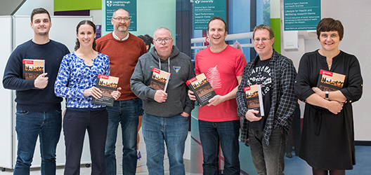 Pictured, from left to right, are Dr Andrew Kingsnorth, Dr Lauren Sherar, Prof Paul Downward, Prof Alan Bairner, Dr Joe Piggin, Dr Dominic Malcolm and Dr Carolynne Mason with copies of the Routledge Handbook of Physical Activity Policy and Practice.