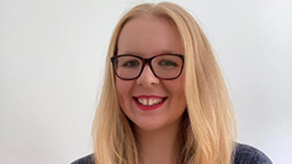 Headshot of Mechanical Engineering student Becky, smiling at the camera.