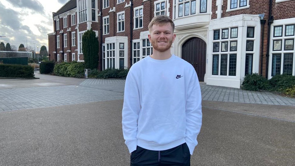 Alex standing in front of Rutland building.