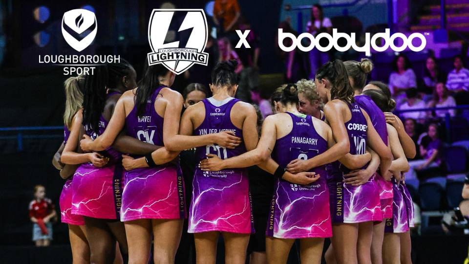 team huddle with logo lock-ups for boobydoo and lightning netball