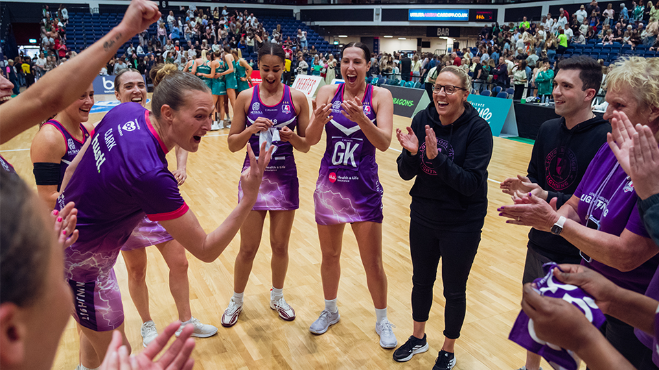 lightning squad stood in a circle cheering and applauding