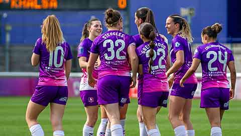 Lightning players conversing on the pitch