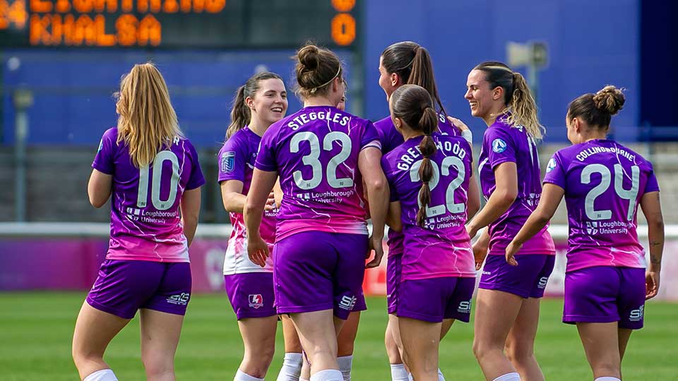 Lightning players conversing on the pitch