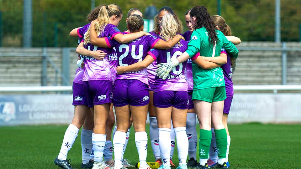 Team huddle on pitch