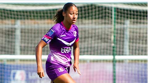 A Lightning football player in action on pitch