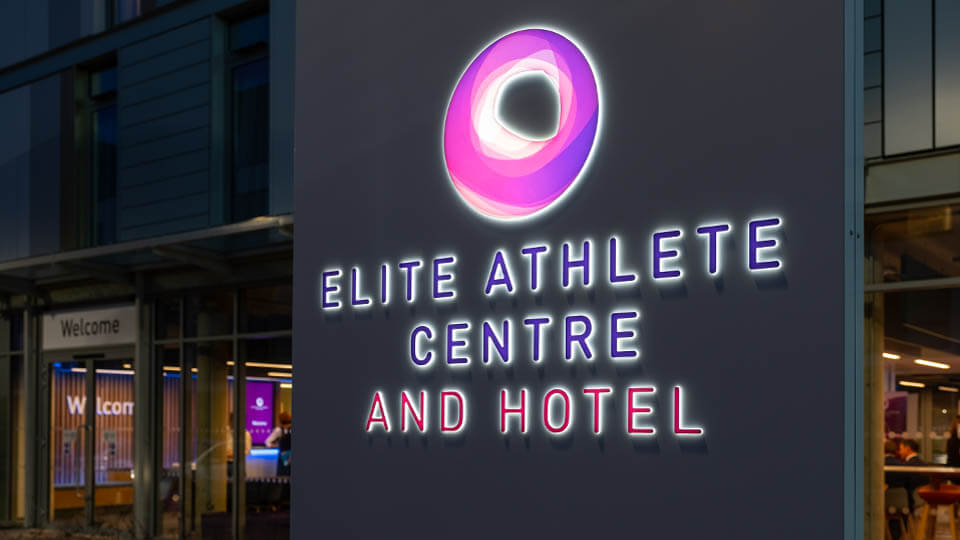 The Elite Athlete Centre and Hotel sign outside the building