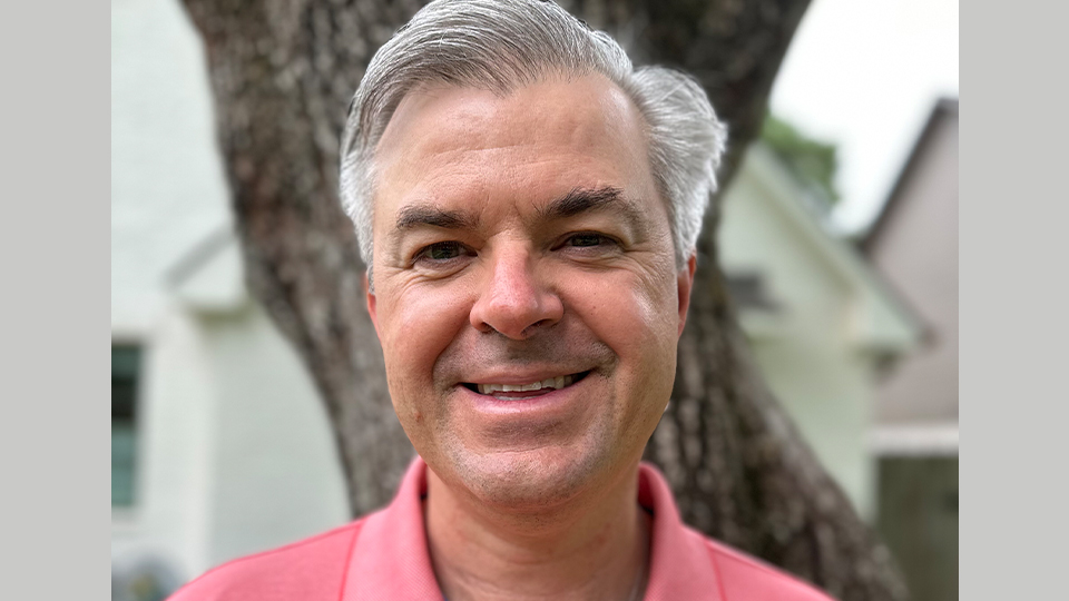 An image of Mark Andrews smiling to the camera