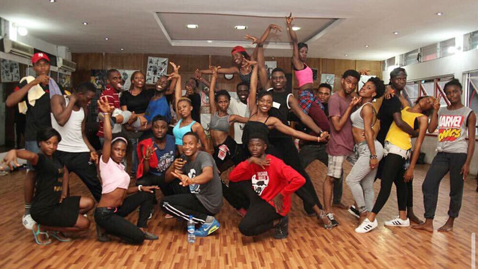 group of people posing at a dance studio