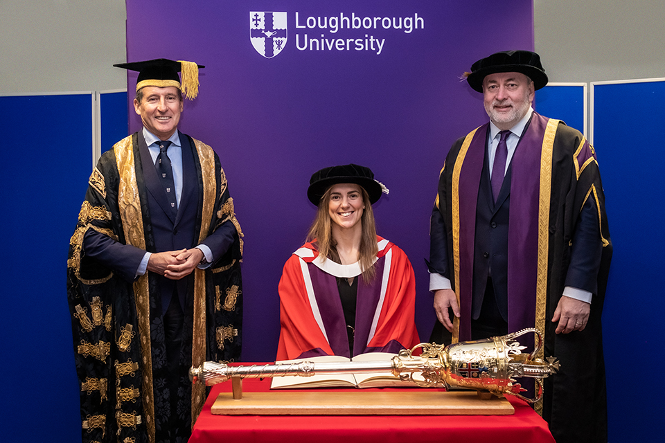 Sarah Hunter seated in the centre of the image with Lord Sebastian Coe to the left of the image and Professor Nick Jennings on the right