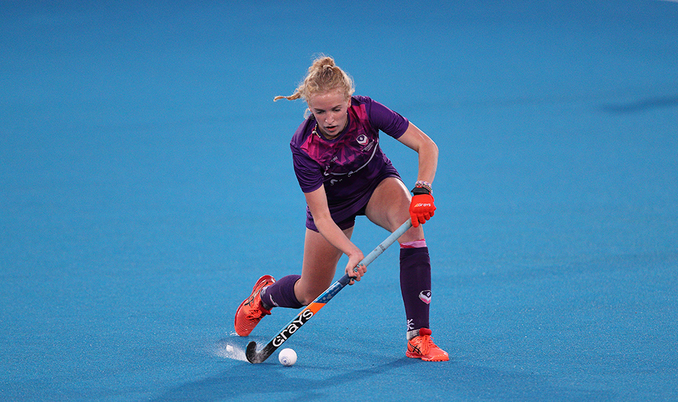 Iona Campbell playing hockey