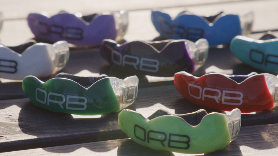 Orb mouthguards in different colours.