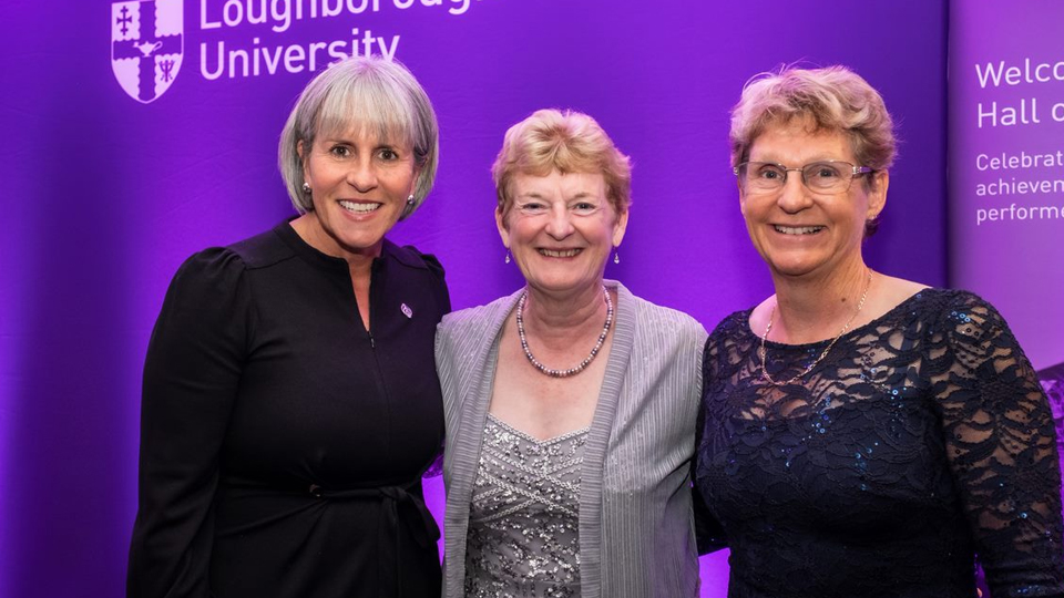 The SSEHS Distinguished Alumni Award recipients standing together in front of a purple background: left to right Sue Anstiss MBE, Professor Jo Harris and Professor Mary Nevill OBE