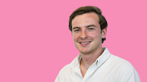 Pink background headshot of Ronan Harvey-Kelly