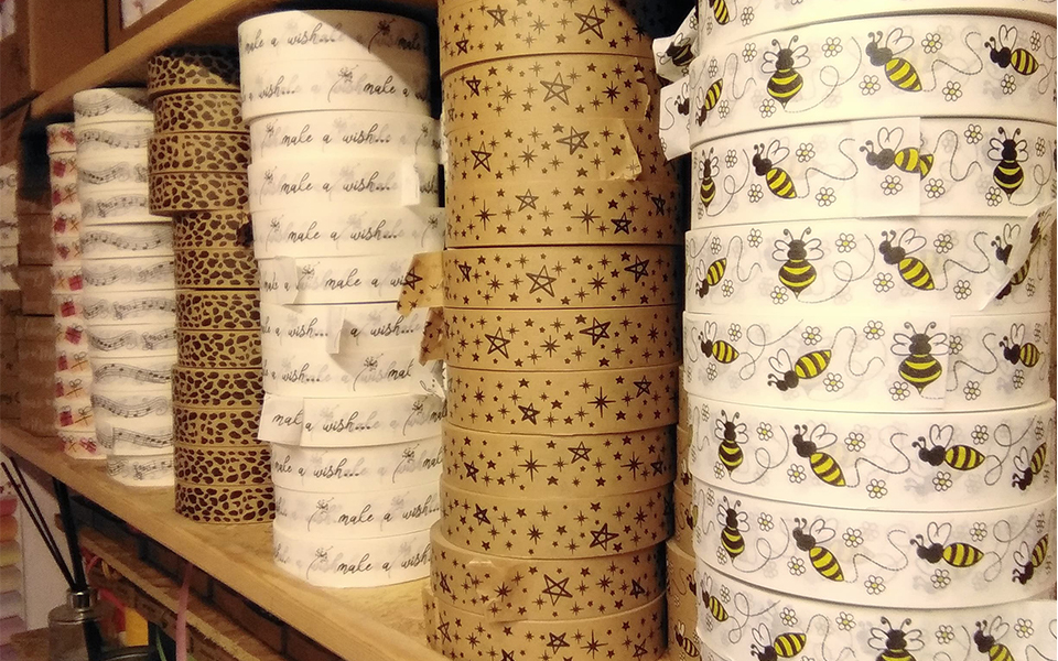stacked rolls of decorated paper tape