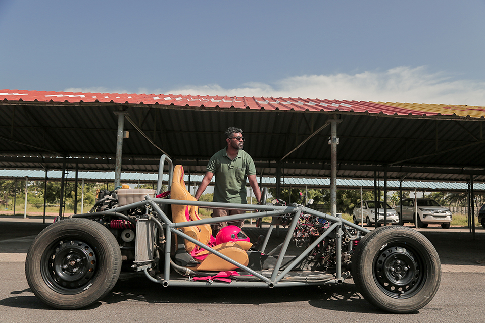 A side view of Pravin's go kart design outside.