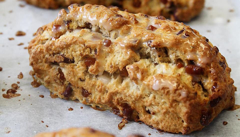 An image of scones lined up in a line.
