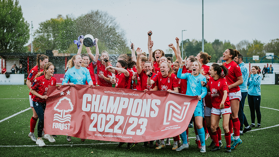 Nottingham Forest Women holding a banner celebrating becoming League champions. Image: Ami Ford